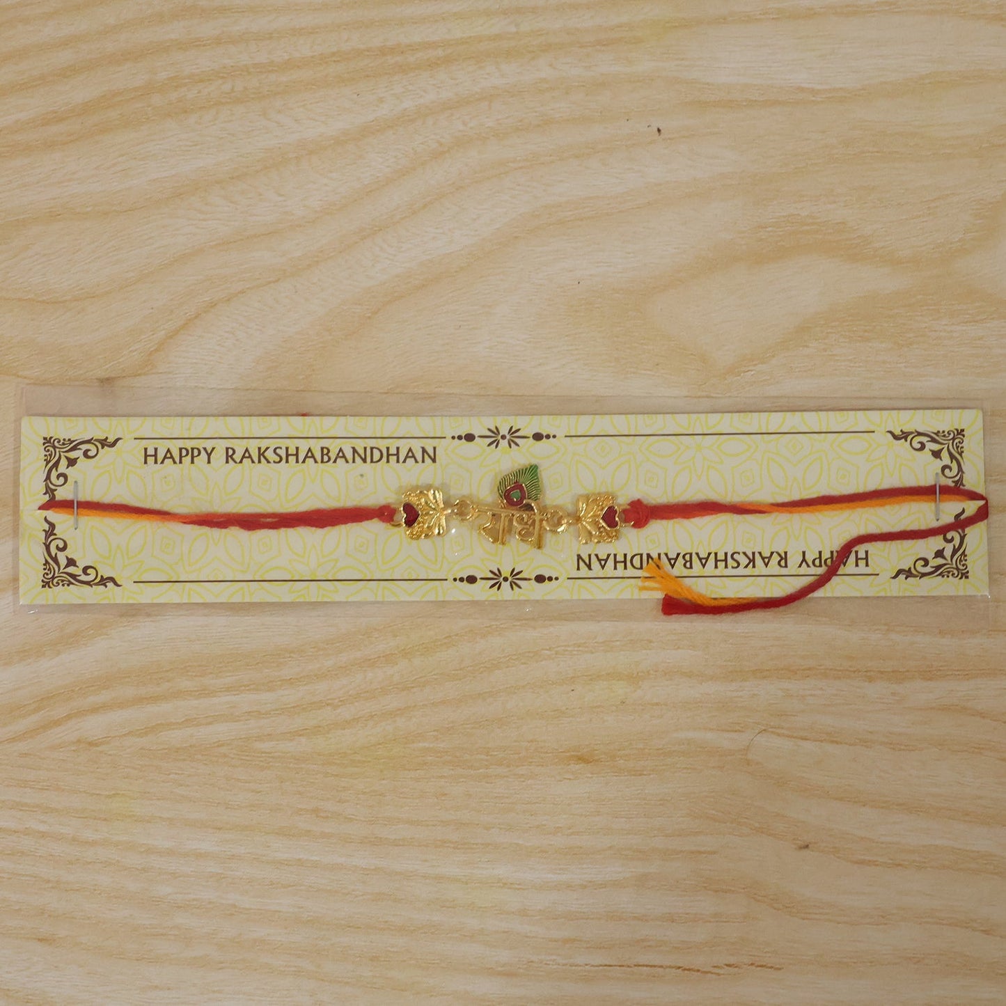 Golden 'Radhe' Rakhi with Peacock Feather