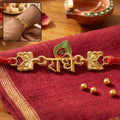 Golden Radhe Peacock Feather Rakhi – Festive Design for Raksha Bandhan