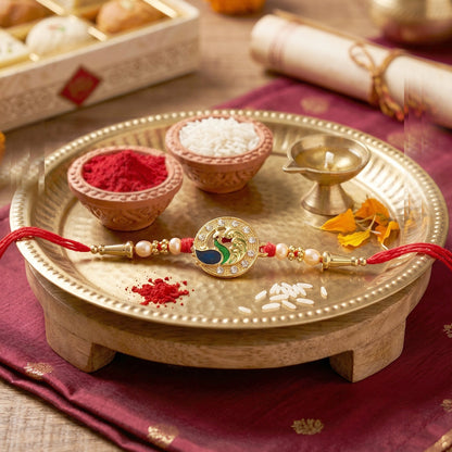 Golden Peacock Rakhi with CZ Stones