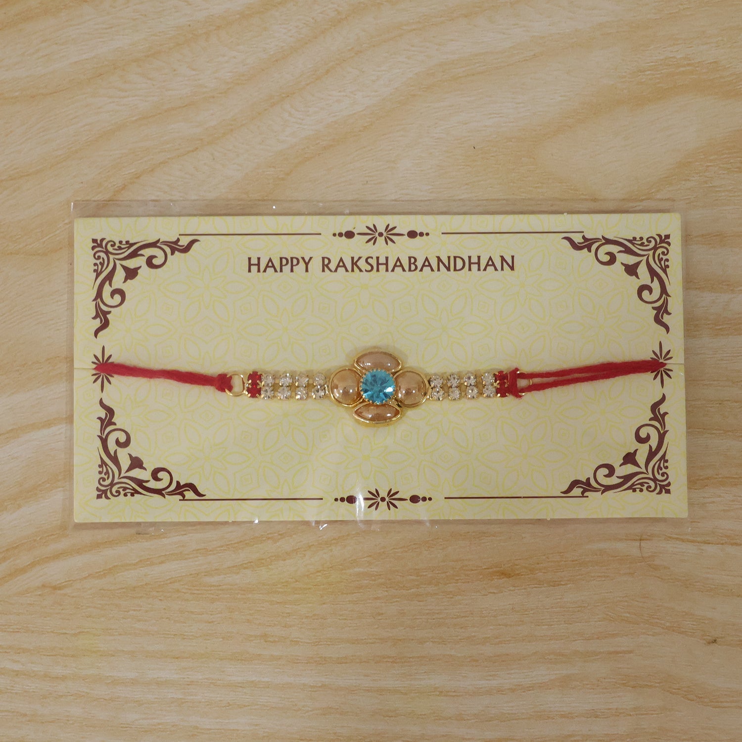 Floral American Diamond Rakhi with Turquoise