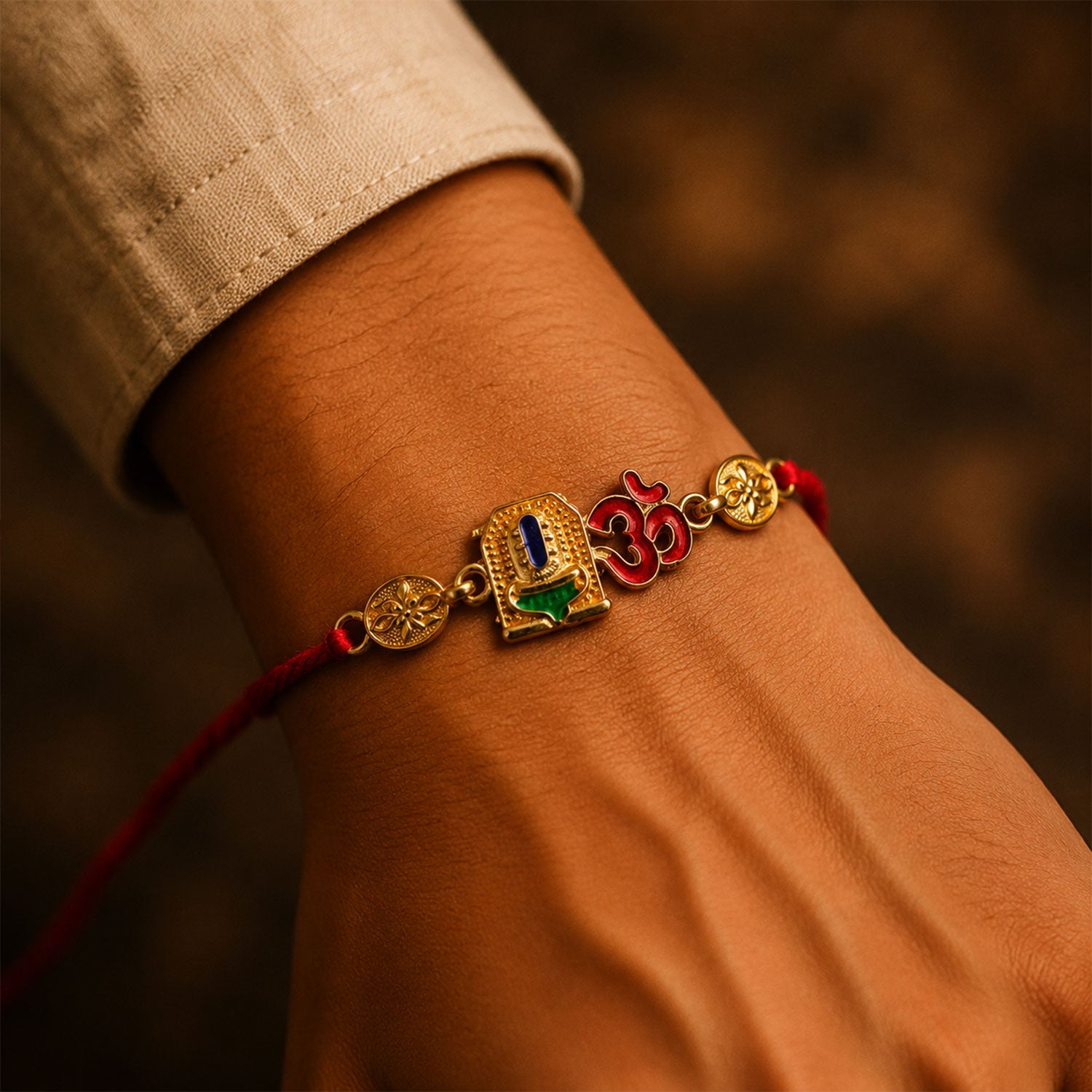 Golden 'Om' Rakhi with Blue Stone & Leaf