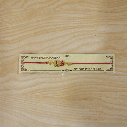 Golden 'Om' Rakhi with Blue Stone & Leaf