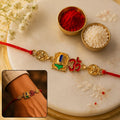 Golden Om Rakhi with Blue Stone Leaf for Raksha Bandhan