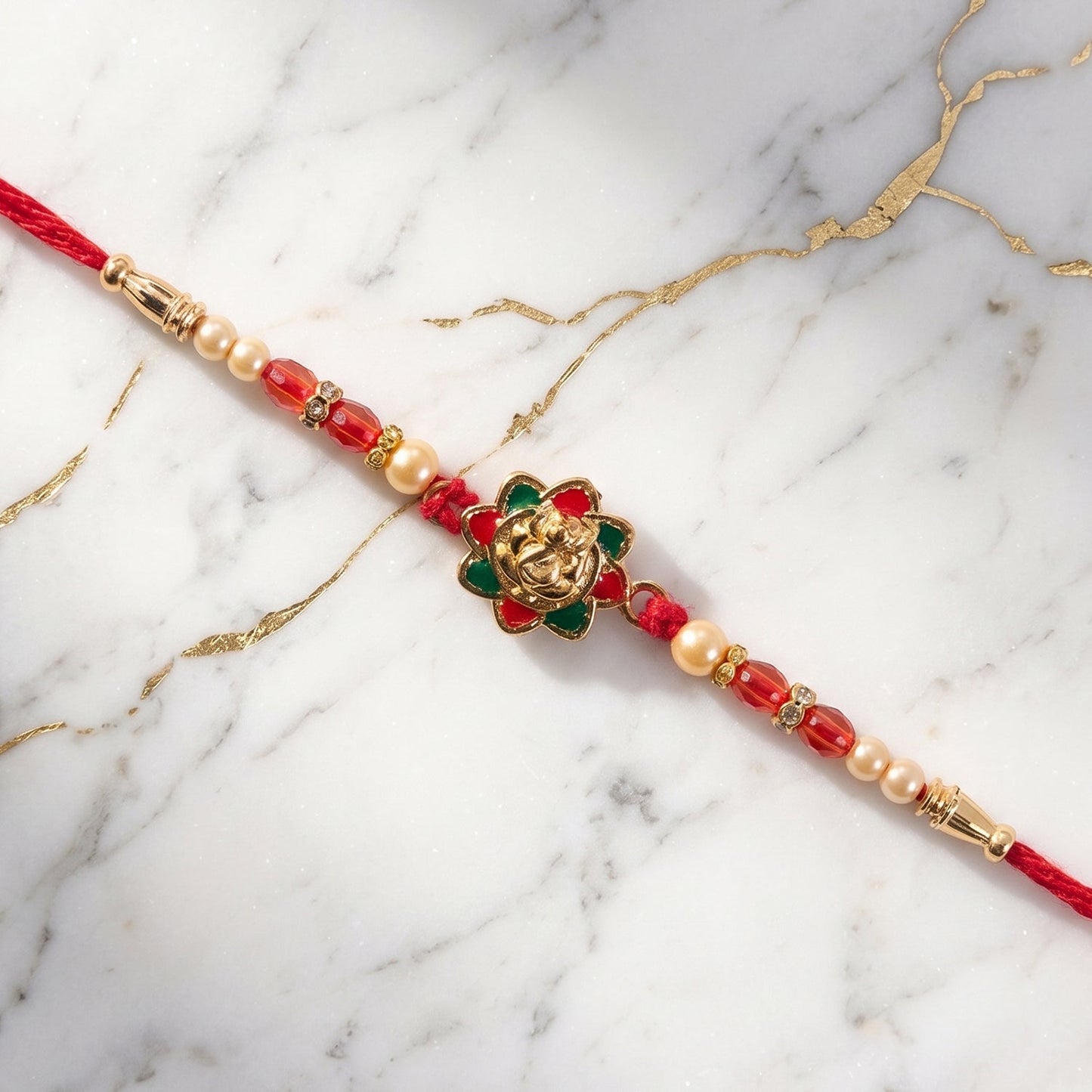 Traditional Golden Floral Meenakari Rakhi with Pearls & Red Beads for Brother - Rakshabandhan Gift