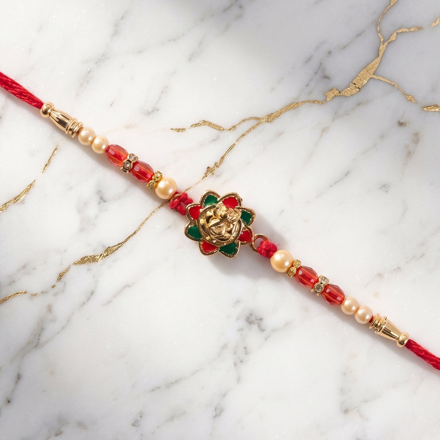 Traditional Golden Floral Meenakari Rakhi with Pearls & Red Beads for Brother - Rakshabandhan Gift
