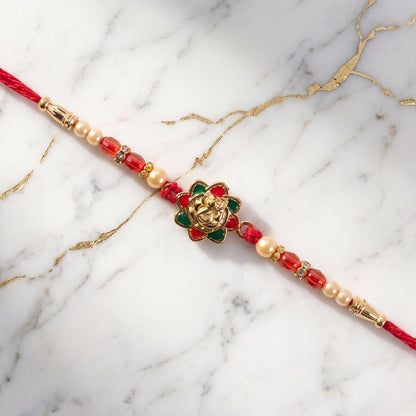 Traditional Golden Floral Meenakari Rakhi with Pearls & Red Beads for Brother - Rakshabandhan Gift