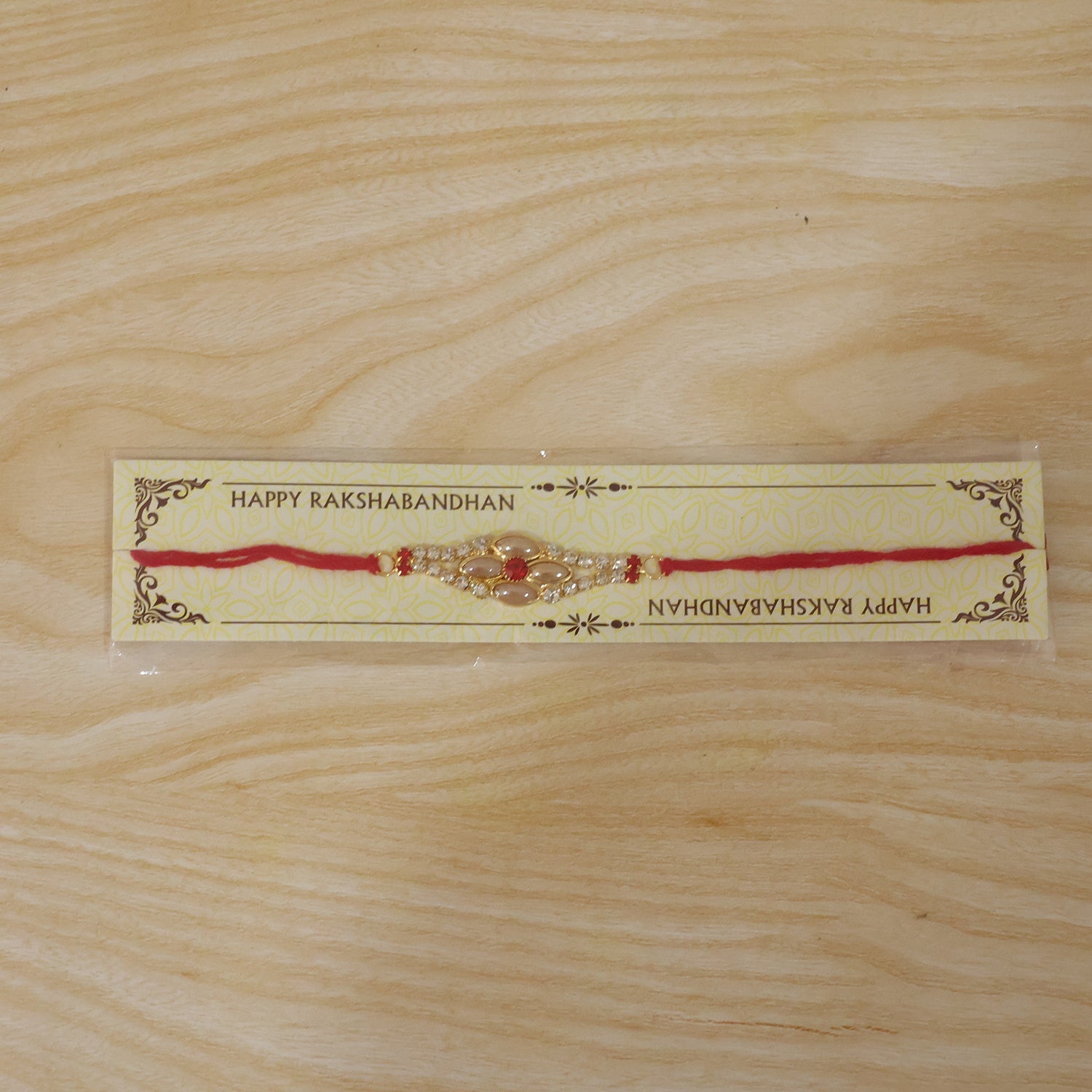 Stylish Stone Floral Rakhi with Pink Pearl Beads for Bhaiya - Rakshabandhan Gift
