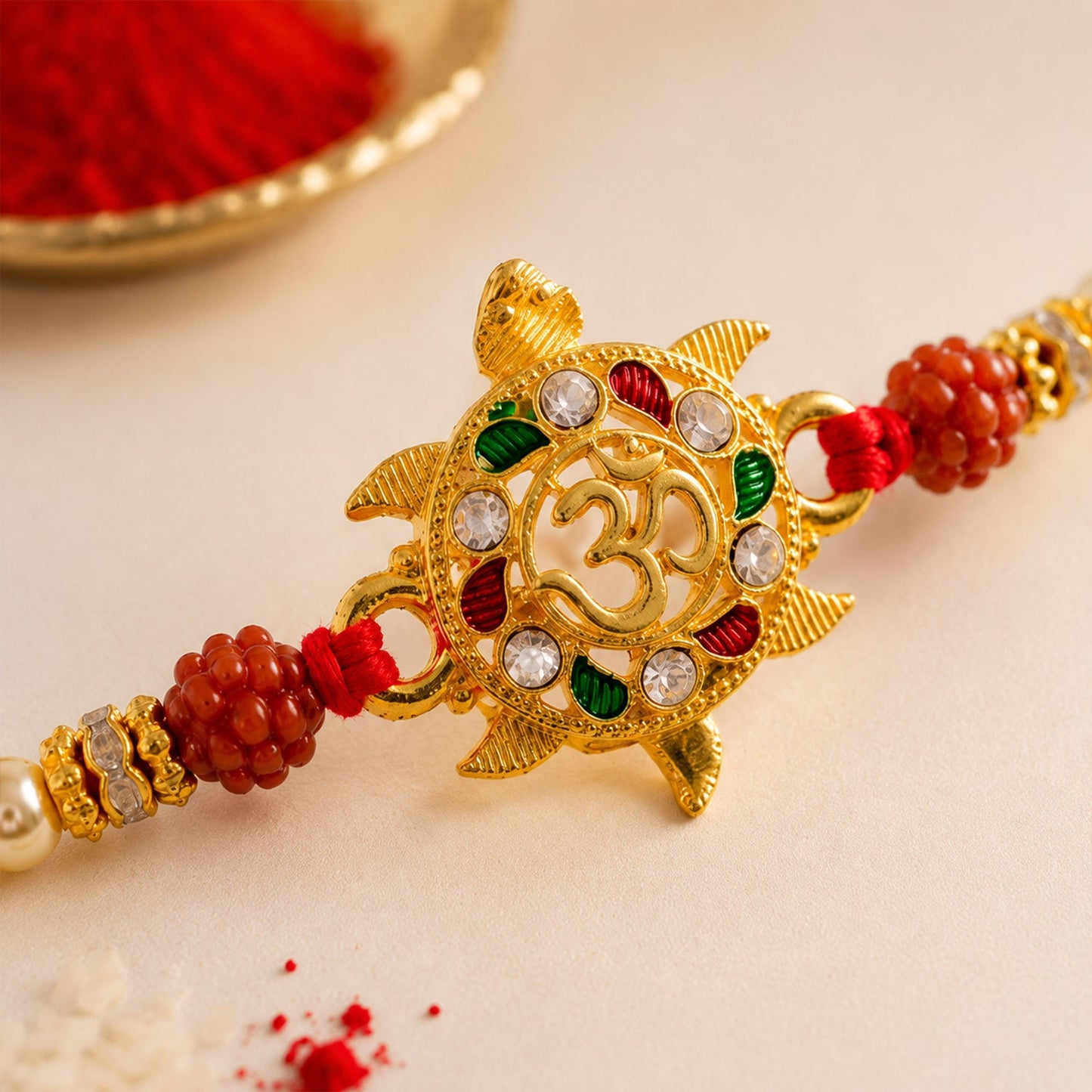 Auspicious Golden Tortoise Om Rakhi with Meenakari & Rudraksha Beads for Brother