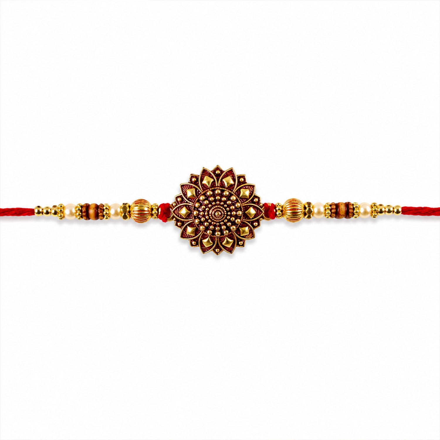 Close-up of the red thread and golden beads of the Rakhi