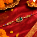 Golden Lotus Floral Rakhi – Green Stone AD for Raksha Bandhan