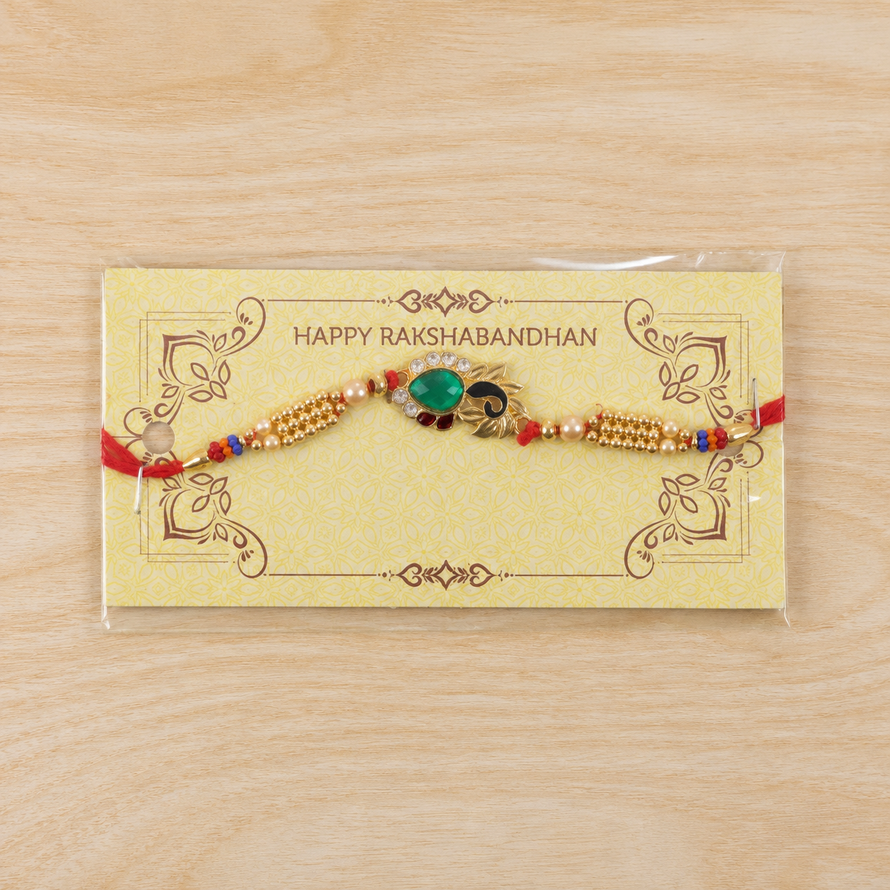 Golden Lotus Floral Rakhi with Green Stone & AD Stones for Brother