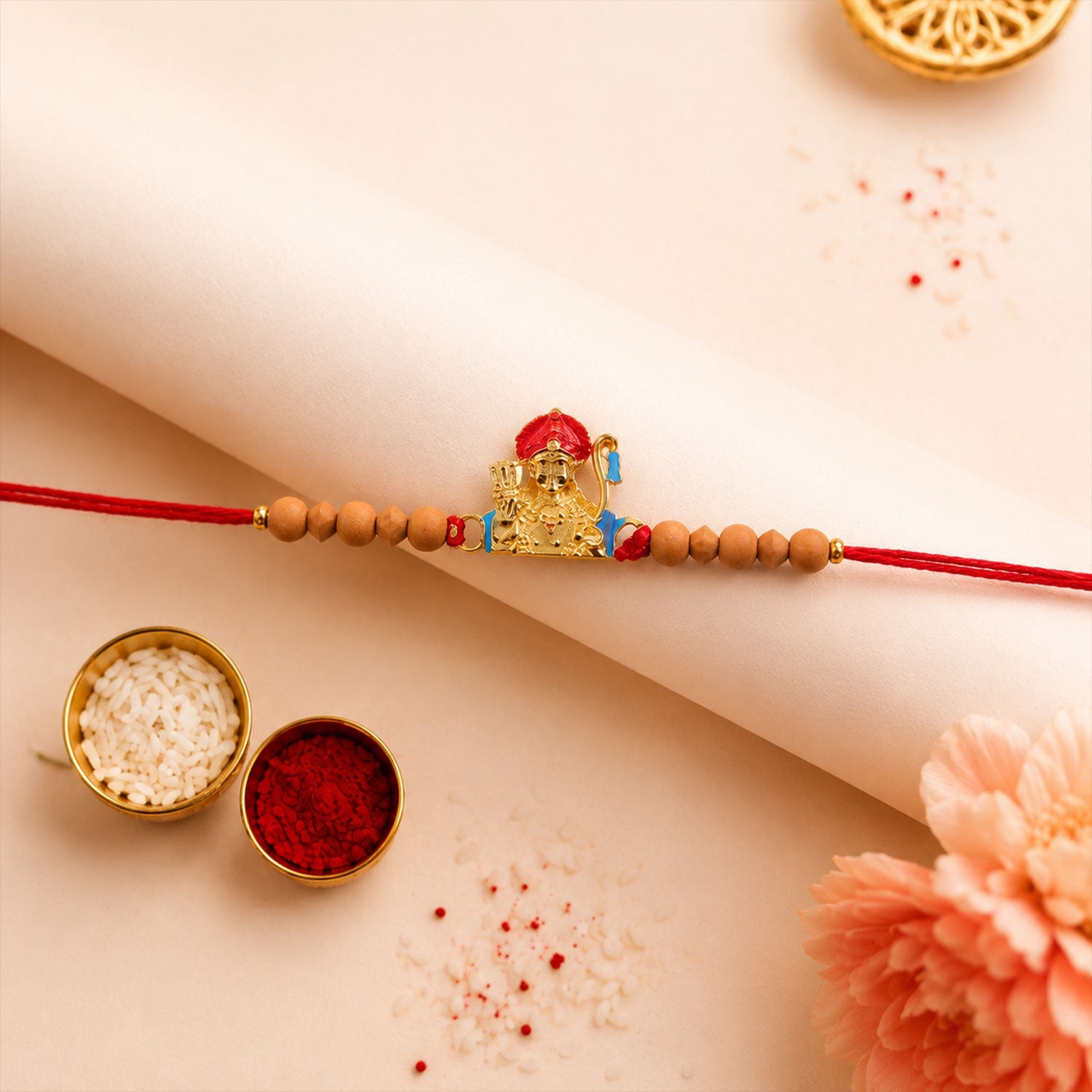 Auspicious Golden Deity Rakhi with Sandalwood Beads for Brother