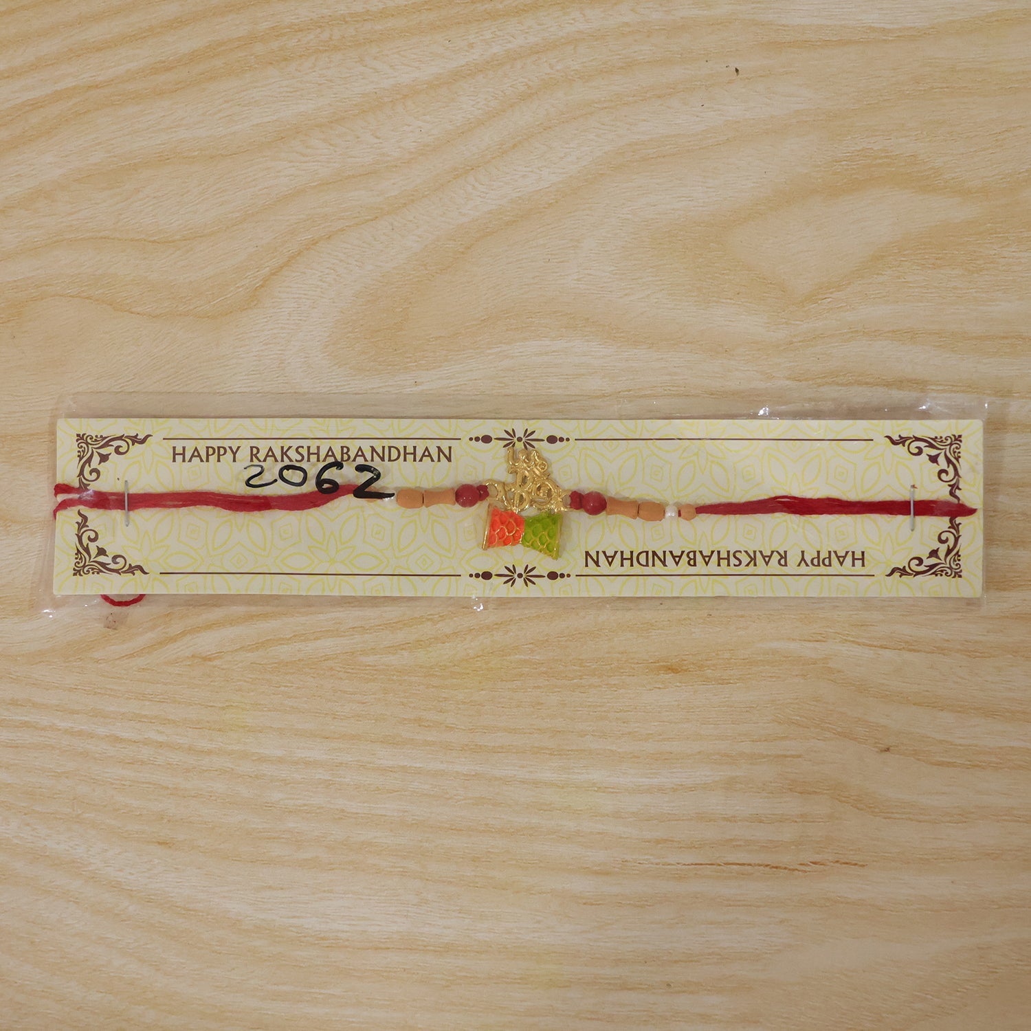 Fancy Golden Om Rakhi with Colourful Kite Charm for Brother - Kids Rakhi