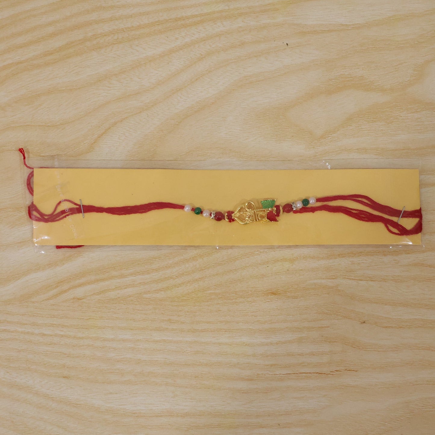 Elegant Golden Shiv Meenakari Rakhi with Beads for Brother