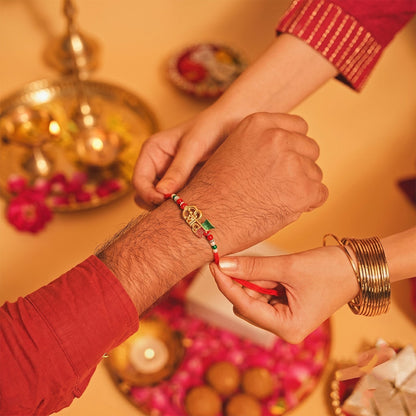 Elegant Golden Shiv Meenakari Rakhi with Beads for Brother