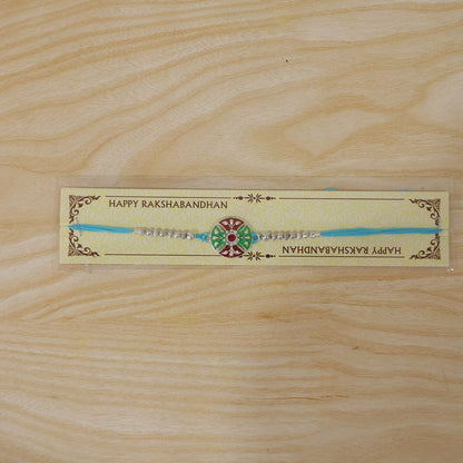 Meenakari Rakhi with floral pattern & blue thread for brother