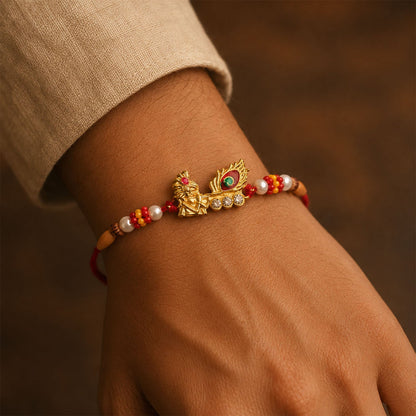 Lord Krishna with Peacock Feather Golden Rakhi with AD Stones for Brother