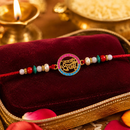 Close-up of Golden Jay Shree Shyam Rakhi showing Hindi text & pearls