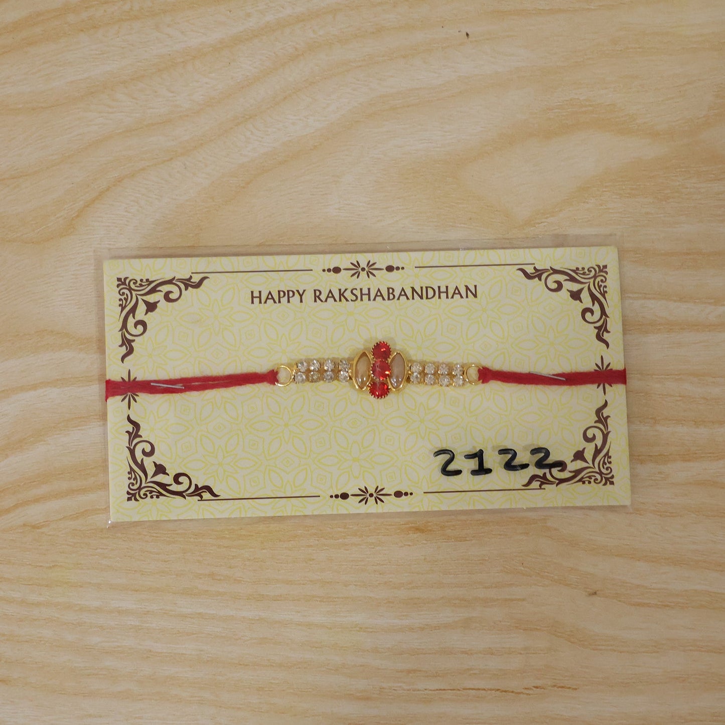 Back view of the traditional thread on the gold rakhi