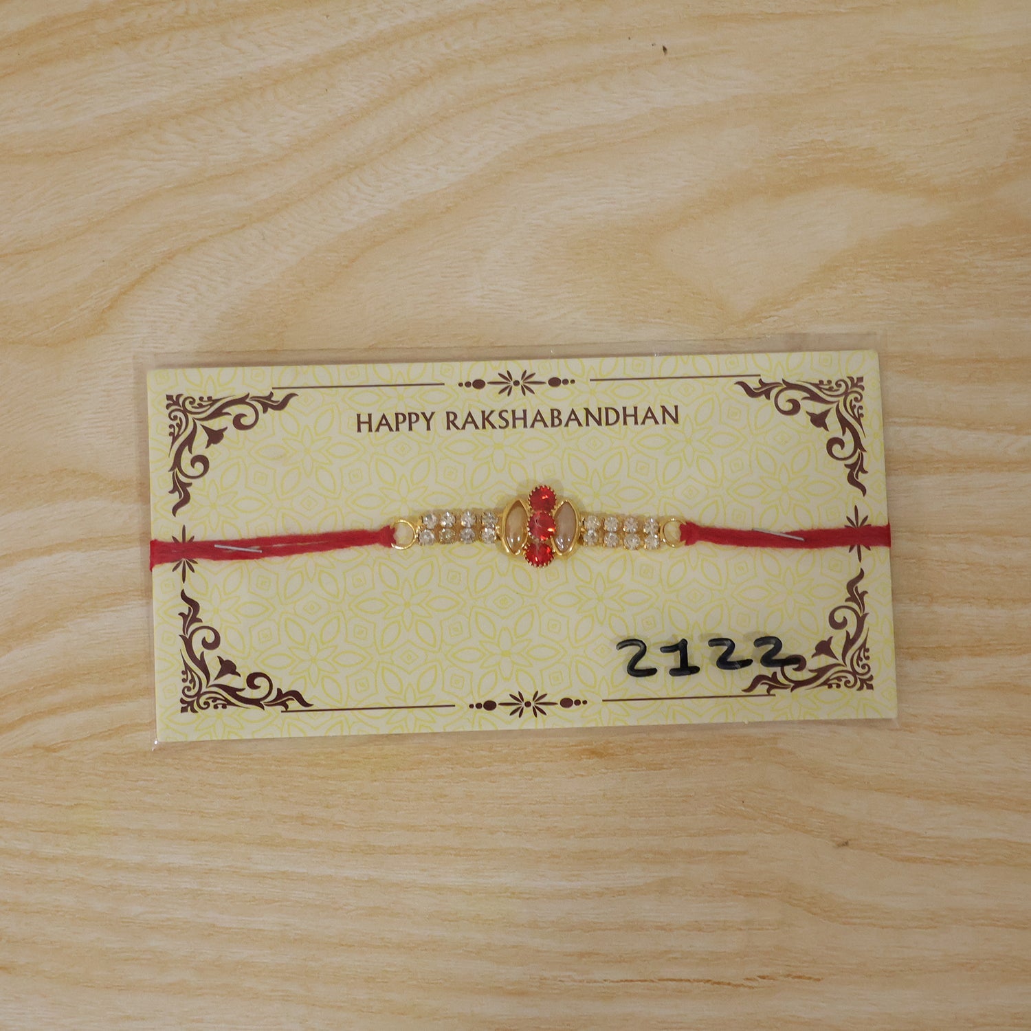 Back view of the traditional thread on the gold rakhi