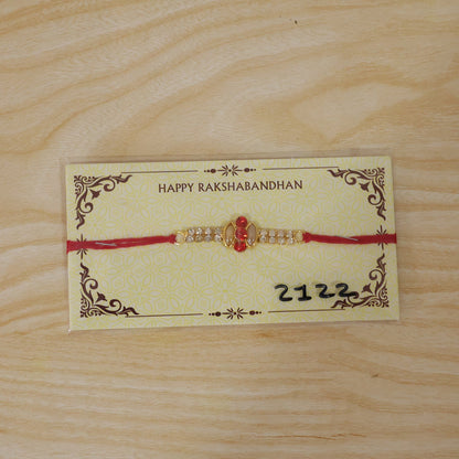 Back view of the traditional thread on the gold rakhi