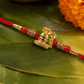 Shivling Rakhi – Traditional Antique Golden with Red Beads for Brother