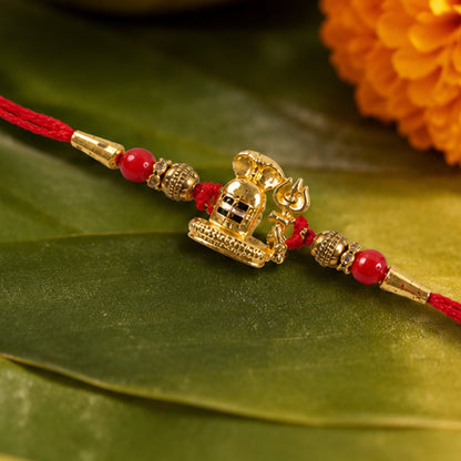 Traditional Golden Antique Shivling Motif Rakhi with Red Beads for Brother