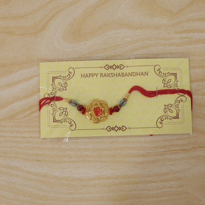 Golden Floral Rakhi with Red Stone & Crystal Beads for Brother