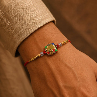 Golden Elephant Rakhi with Colourful Stones for Brother