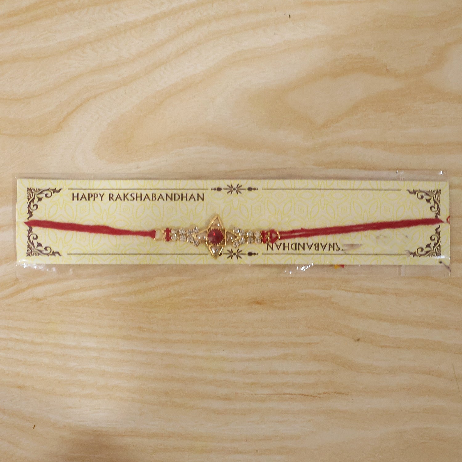 Sparkling Gold Marquise Rakhi with Red Stone & AD for Brother