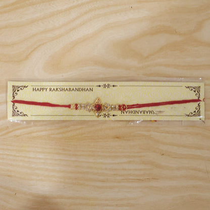 Sparkling Gold Marquise Rakhi with Red Stone & AD for Brother