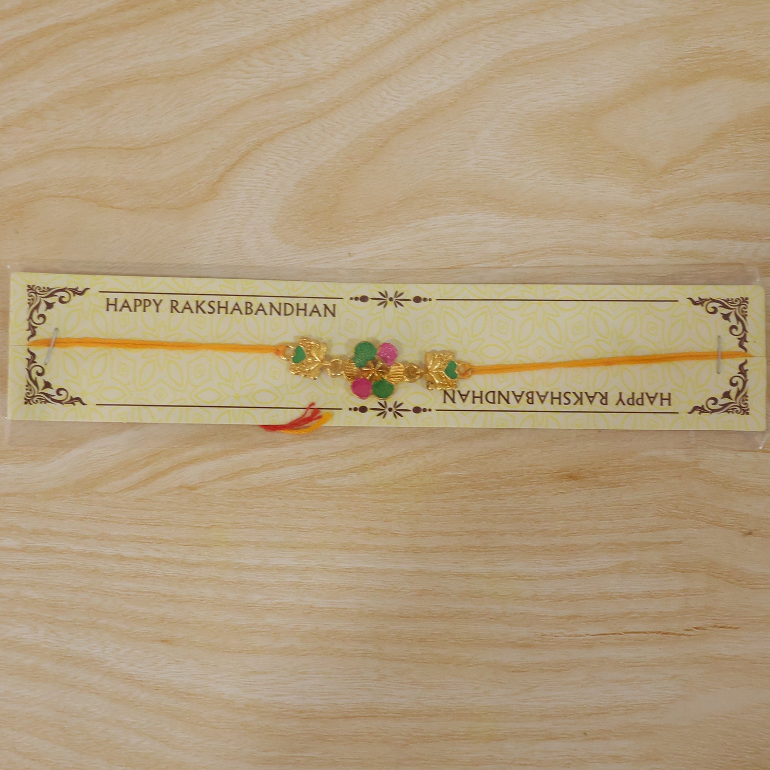 Golden Meenakari Flower Rakhi with Leaf Design for Brother