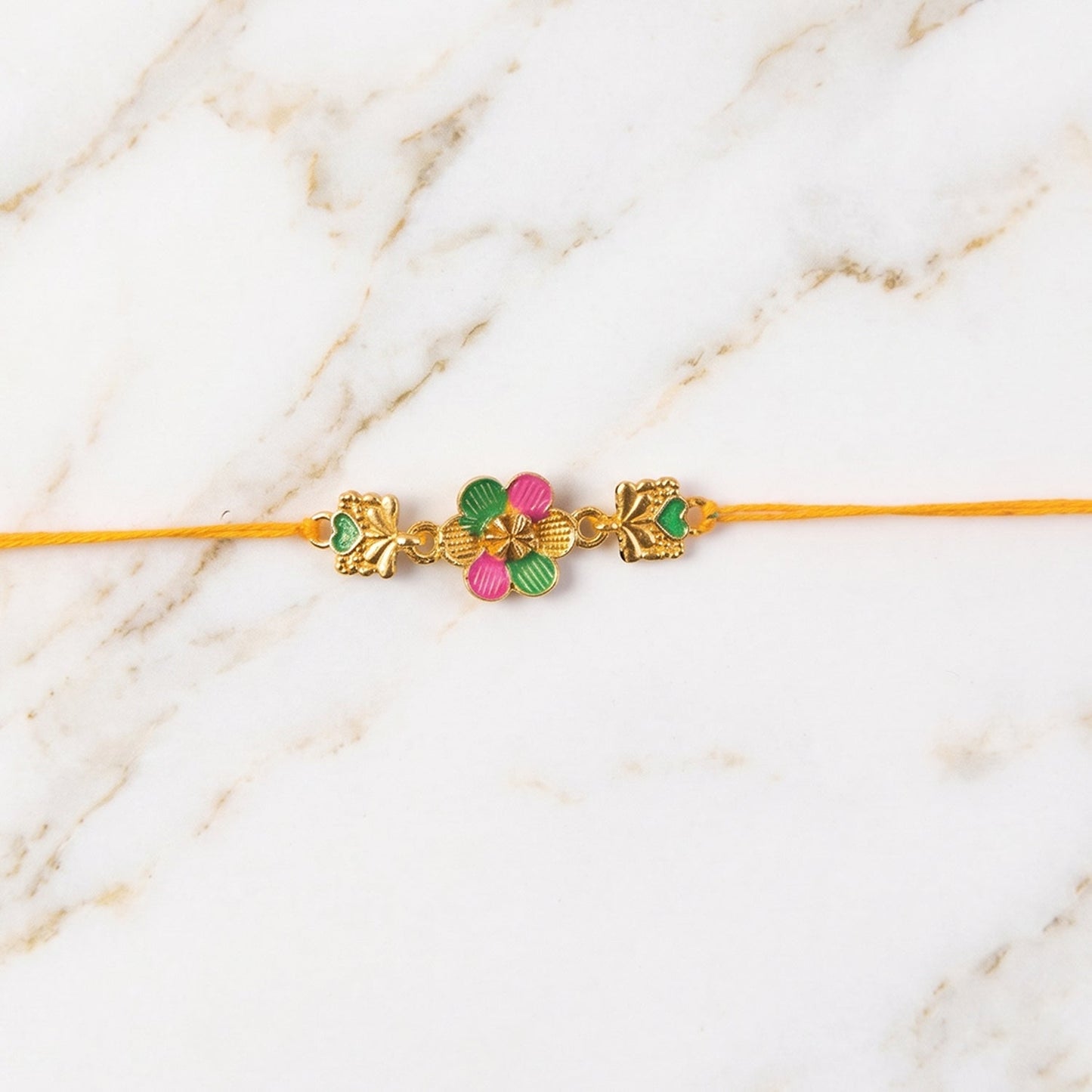 Golden Meenakari Flower Rakhi with Leaf Design for Brother