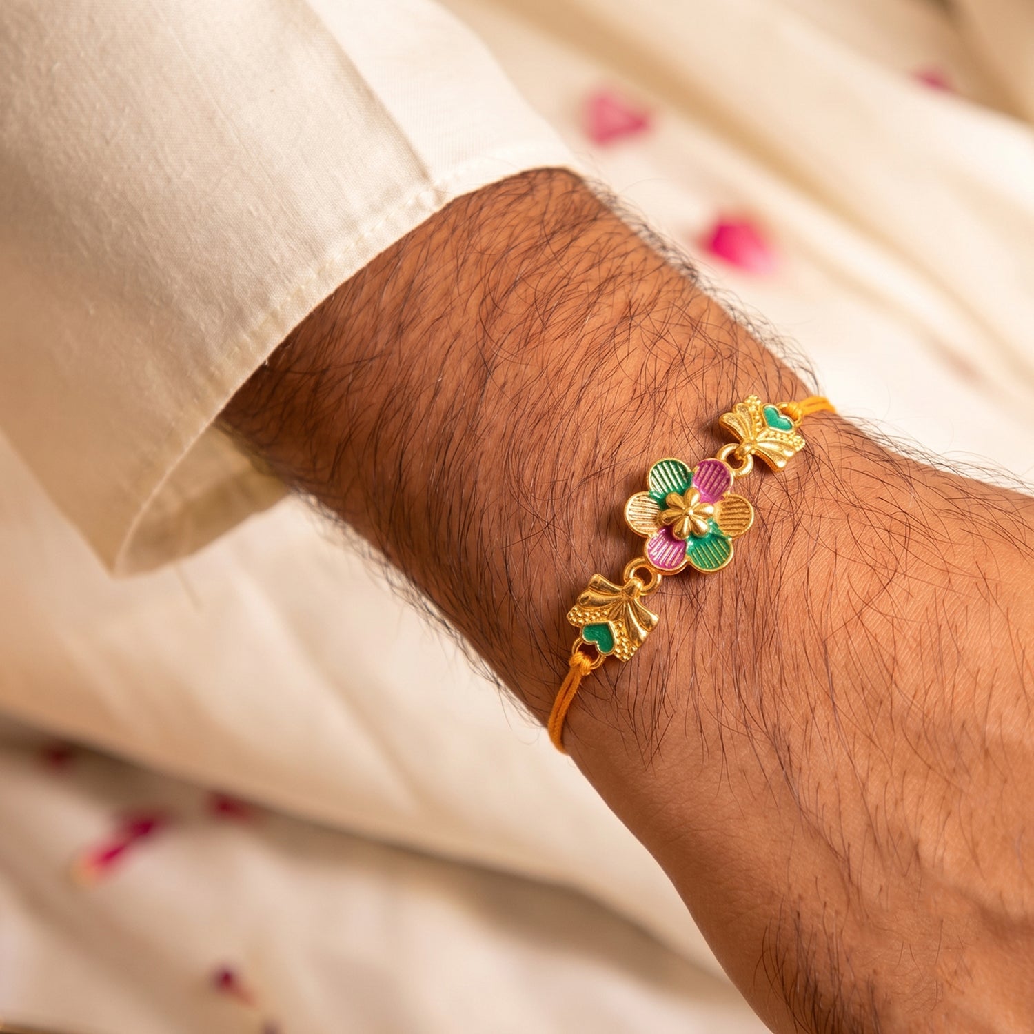 Golden Meenakari Flower Rakhi with Leaf Design for Brother