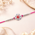 Designer Rakhi for Brother – Silver Floral with Red Stone