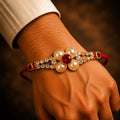 Designer Rakhi for Brother – Gold Pearl AD Stones for Festive Charm
