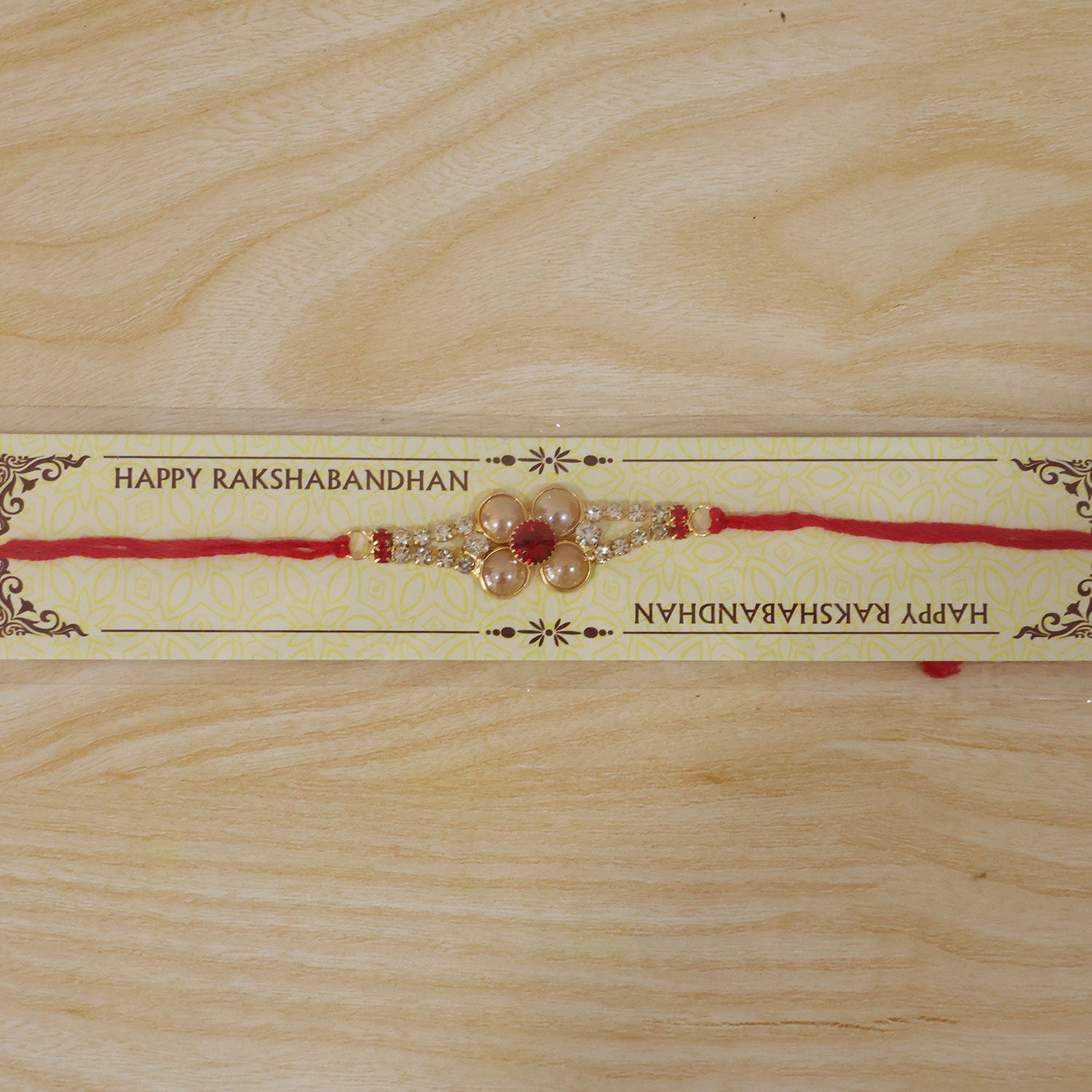 Designer Gold Pearl Flower Rakhi with AD Stones for Brother
