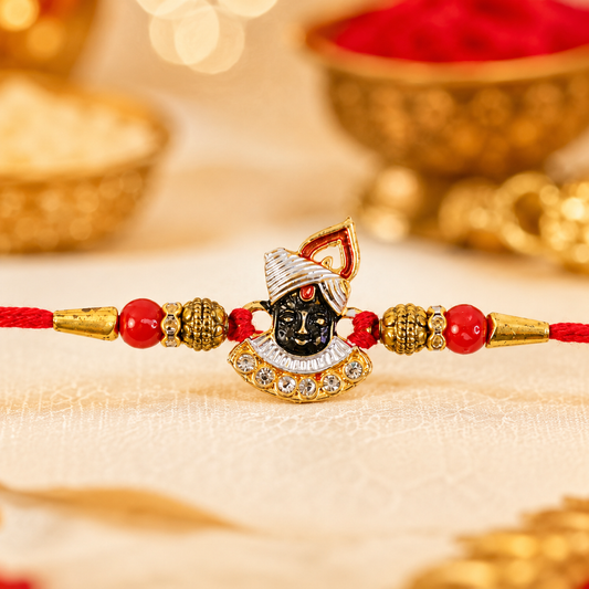 Full view of the stylish Red Beads Rakhi on a white surface.