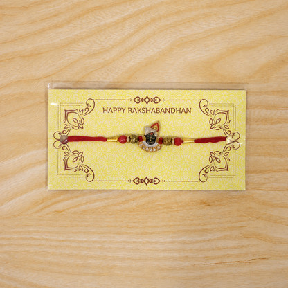 Divine Face Rakhi with AD Stones & Red Beads for Brother