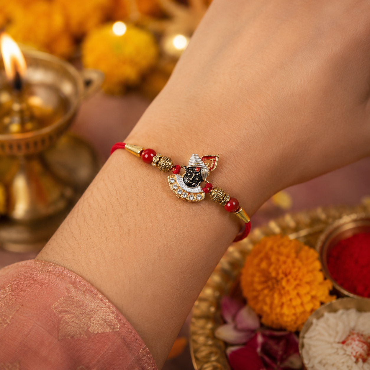 Divine Face Rakhi with AD Stones & Red Beads for Brother