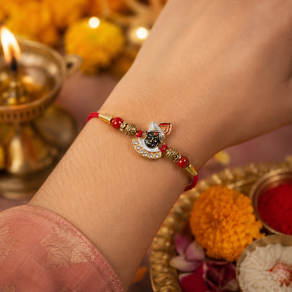 Divine Face Rakhi with AD Stones & Red Beads for Brother