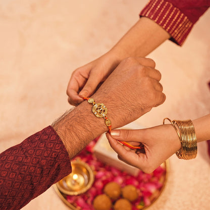 Traditional Golden Rakhi with Leaf Design for Brother