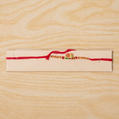 Simple Golden Om Rakhi with Beads for Brother - Raksha Bandhan Special