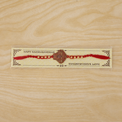 Antique Leaf-Shaped Jali Rakhi with Golden Beads for Brother