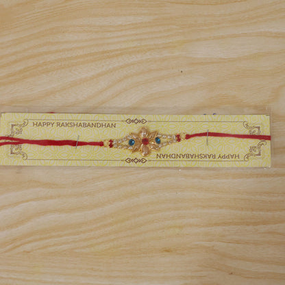 Designer Pearl Flower Rakhi with Blue & Red Stones for Brother