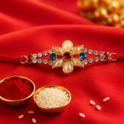 Designer Pearl Flower Rakhi with Blue & Red Stones for Brother