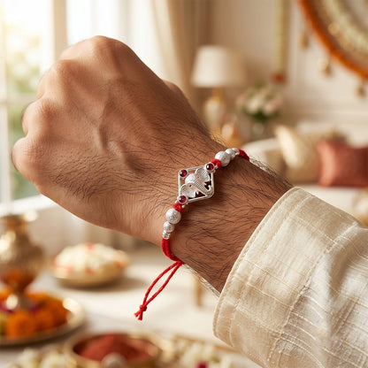 Silver-Tone Ganehsa Rakhi with Red Stone & Pearls for Brother