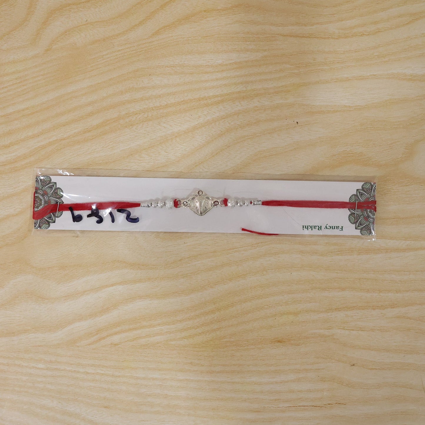 Silver-Tone Ganehsa Rakhi with Red Stone & Pearls for Brother