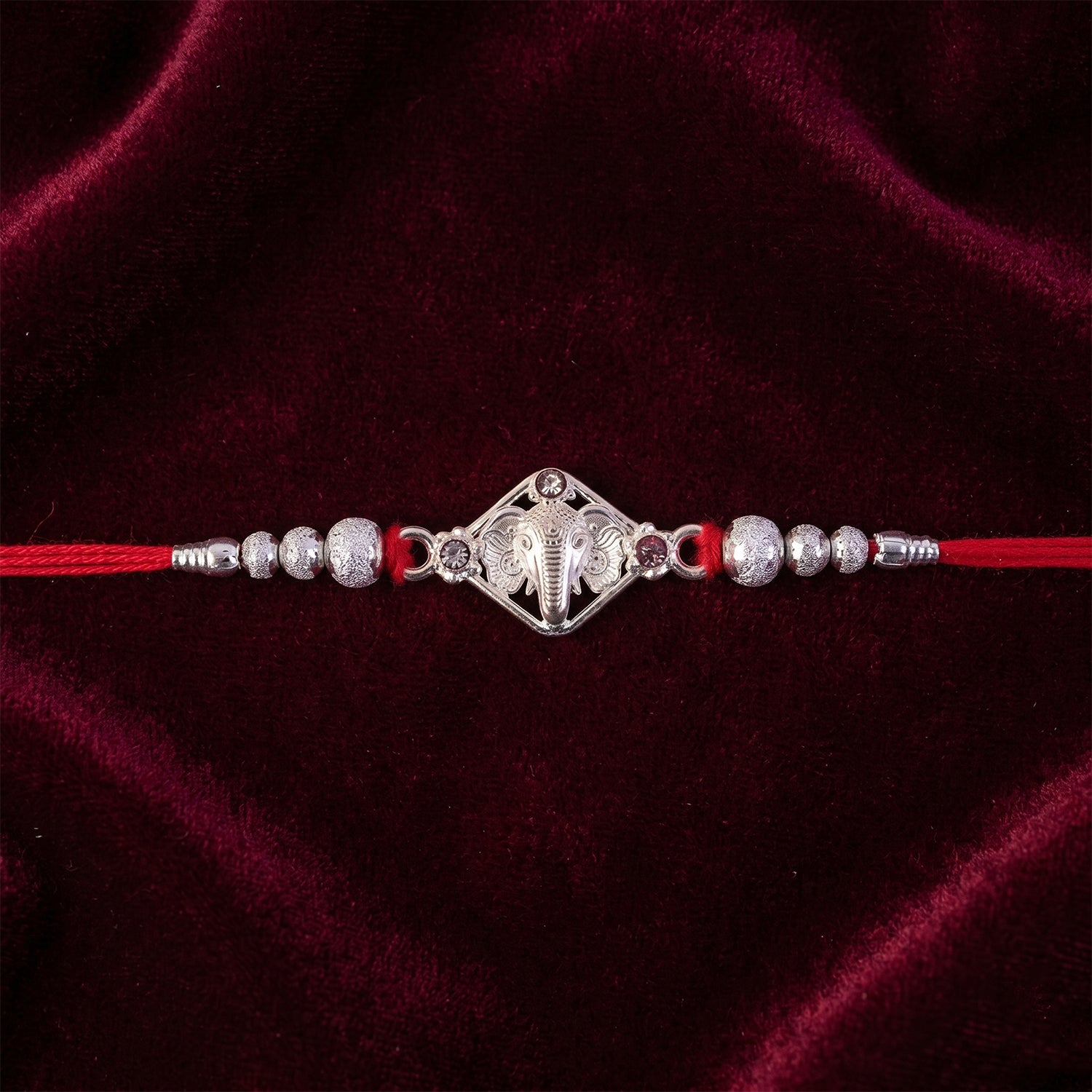 Silver-Tone Ganehsa Rakhi with Red Stone & Pearls for Brother