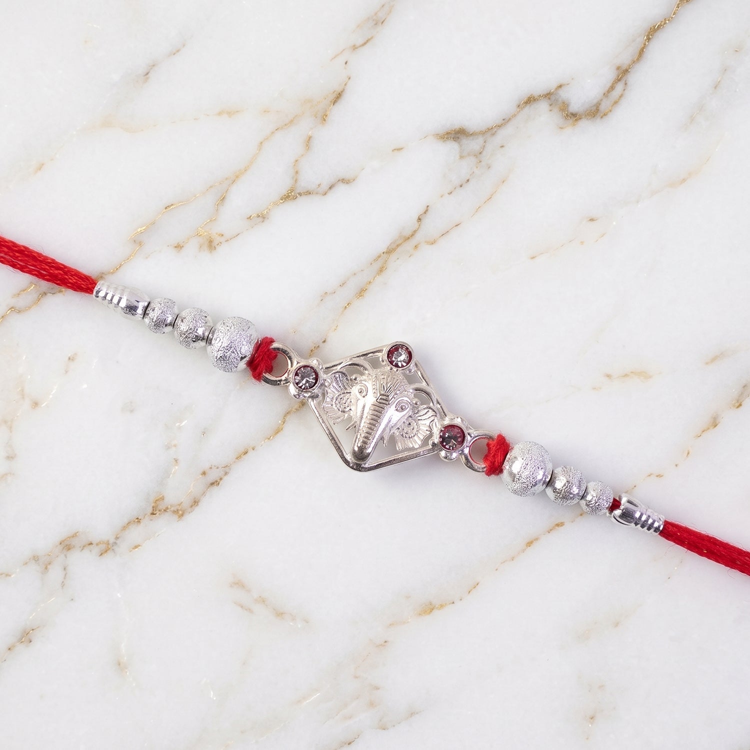 Silver-Tone Ganehsa Rakhi with Red Stone & Pearls for Brother